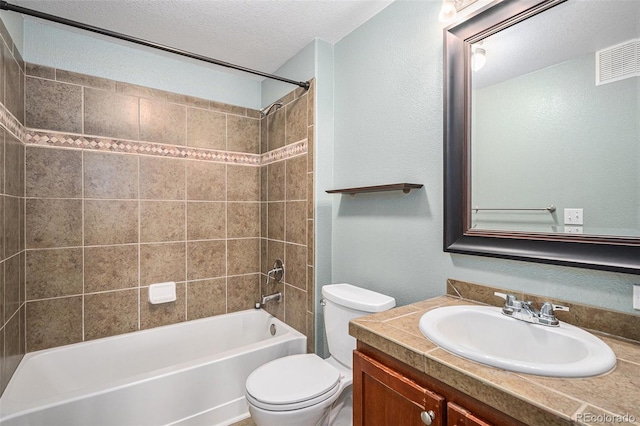 9039 E Panorama Cir Unit C201, Englewood, CO 80112 - full bathroom featuring vanity, a textured ceiling, and tub / shower combination