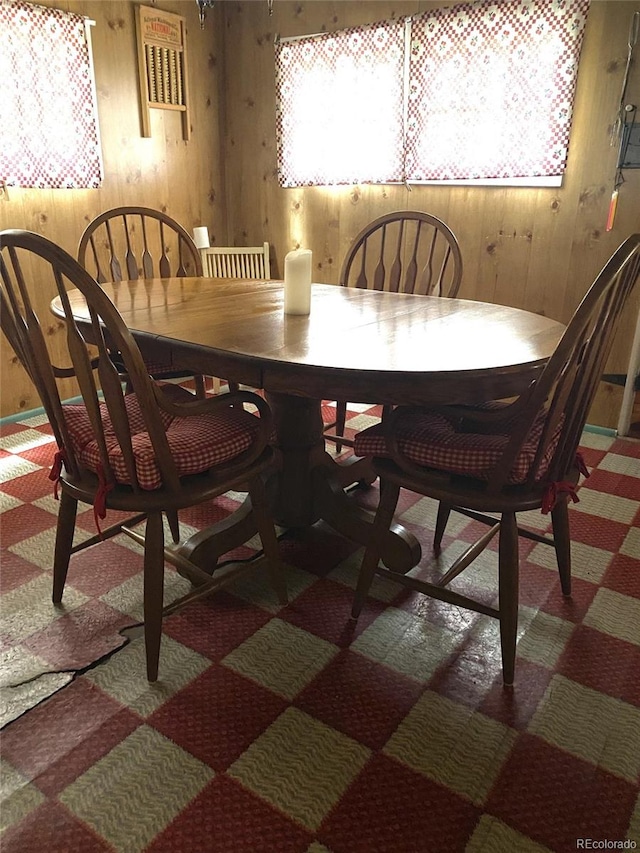 10504 Jackson Creek Rd, Sedalia, CO 80135 - dining room featuring wooden walls and carpet flooring