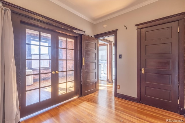 1475 N Humboldt St Unit 22, Denver, CO 80218 - foyer entrance with french doors, light wood finished floors, ornamental molding, and baseboards