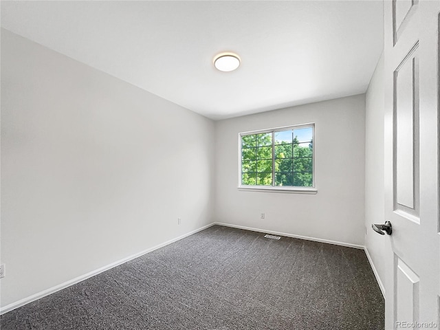 5005 W 128th Pl, Broomfield, CO 80020 - empty room with dark carpet and baseboards