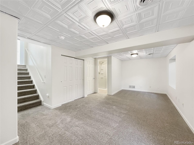 5005 W 128th Pl, Broomfield, CO 80020 - finished basement with carpet floors, stairway, and an ornate ceiling