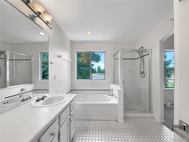 5005 W 128th Pl, Broomfield, CO 80020 - full bath featuring vanity, a bath, and a shower stall