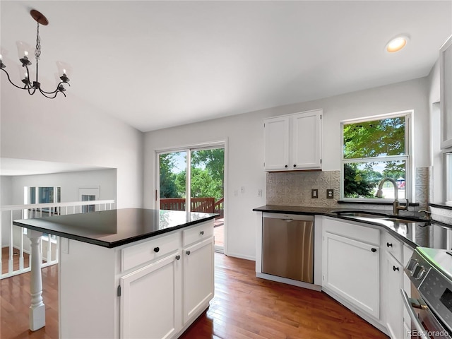 5005 W 128th Pl, Broomfield, CO 80020 - kitchen featuring appliances with stainless steel finishes, dark countertops, backsplash, light wood-style flooring, and recessed lighting