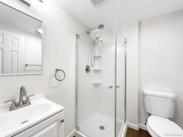 5005 W 128th Pl, Broomfield, CO 80020 - full bath featuring a shower stall, vanity, and wood finished floors