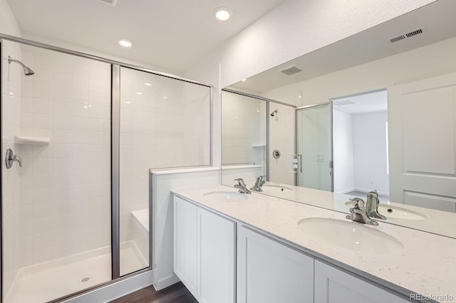 15267 Fillmore St, Thornton, CO 80602 - bathroom featuring a shower stall, double vanity, and recessed lighting