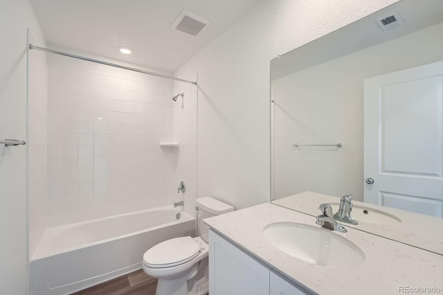 15267 Fillmore St, Thornton, CO 80602 - full bathroom with toilet, wood finished floors, vanity, and washtub / shower combination