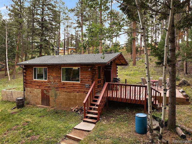 rear view of house with a deck