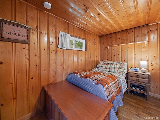 bedroom featuring wooden ceiling, wood-type flooring, and wooden walls