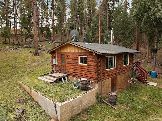 view of side of home featuring a yard