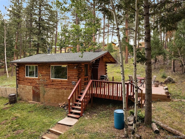 back of house with a wooden deck