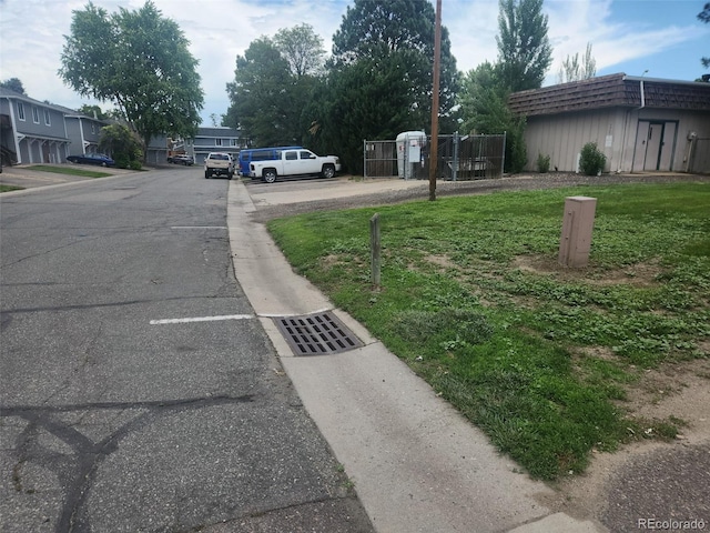 7925 York St Unit 2, Denver, CO 80229 - view of asphalt street with a gate and curbs