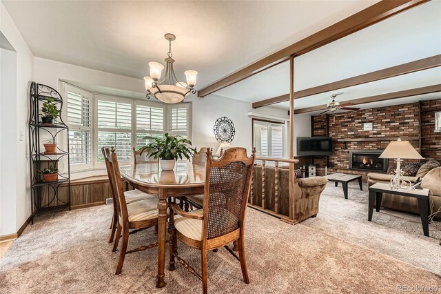 678 S Oswego Ct, Aurora, CO 80012 - dining room featuring light carpet, a chandelier, plenty of natural light, ceiling fan, and beamed ceiling