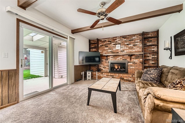 678 S Oswego Ct, Aurora, CO 80012 - living room featuring beam ceiling, ceiling fan, carpet floors, wood walls, and wainscoting