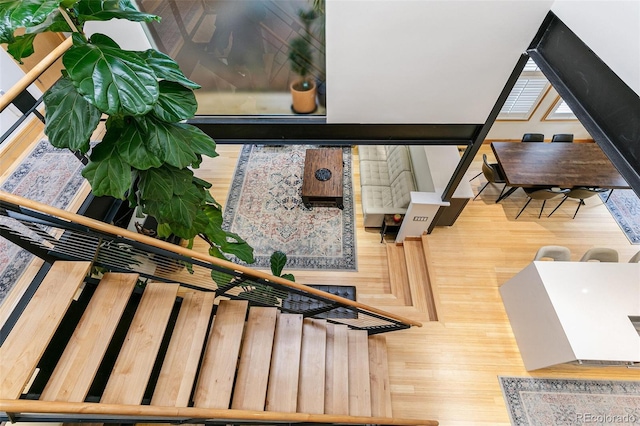 stairs with hardwood / wood-style floors