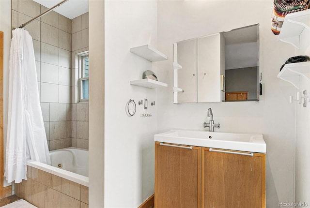 bathroom featuring vanity and shower / bathtub combination with curtain