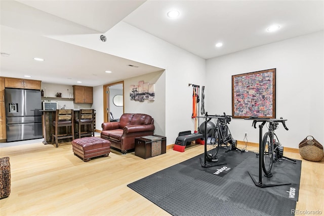 exercise room featuring hardwood / wood-style floors