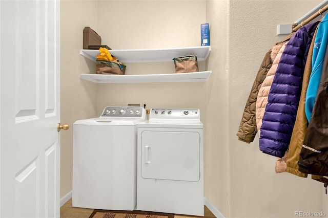 9390 W Chatfield Pl Unit 104, Littleton, CO 80128 - clothes washing area featuring laundry area, baseboards, and washing machine and clothes dryer