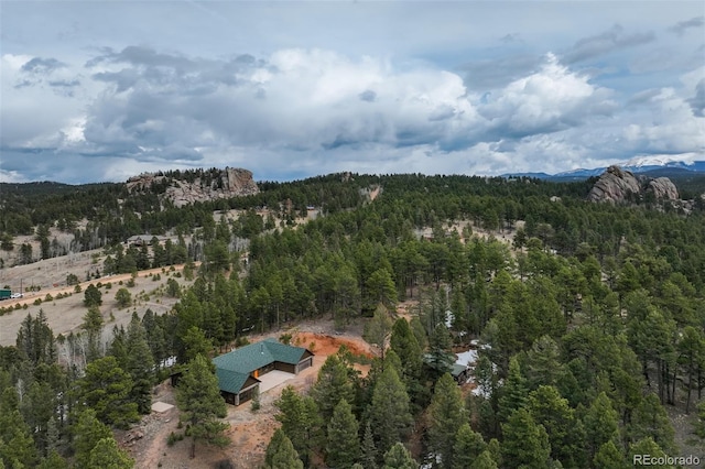 aerial view featuring a mountain view and a forest view