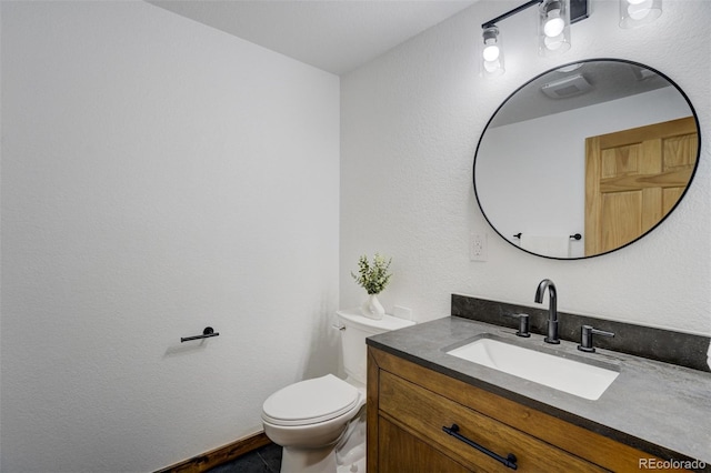 half bath with vanity and toilet