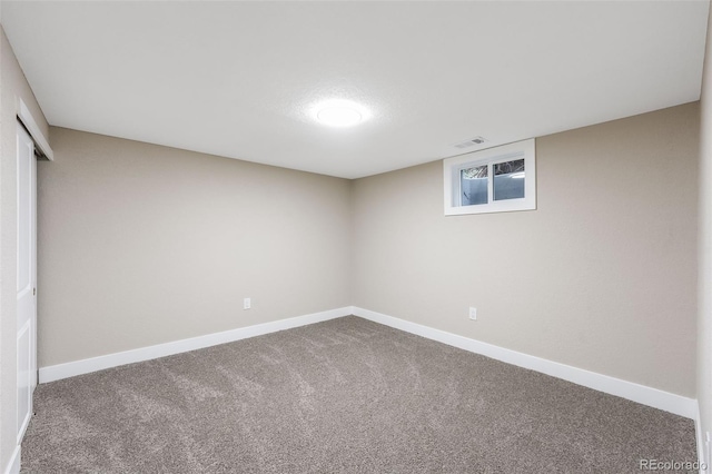 interior space featuring carpet flooring, visible vents, and baseboards