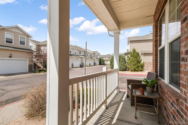 balcony with a residential view and covered porch