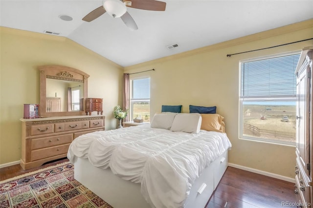 bedroom featuring visible vents, baseboards, wood finished floors, and lofted ceiling
