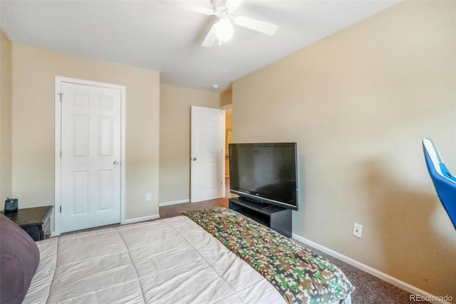 bedroom with ceiling fan, baseboards, and carpet floors