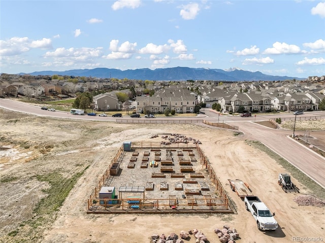 aerial view featuring a mountain view and a residential view