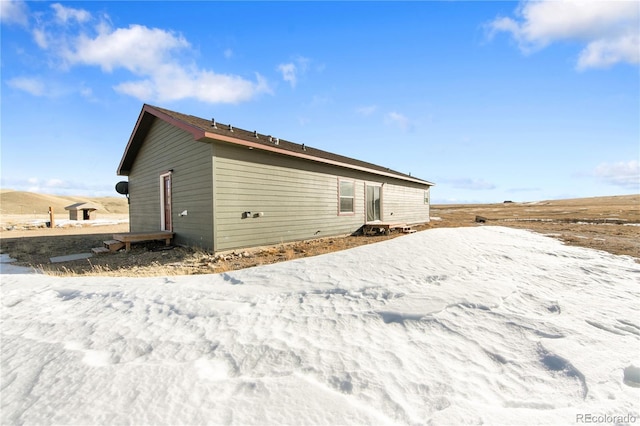 view of snow covered property