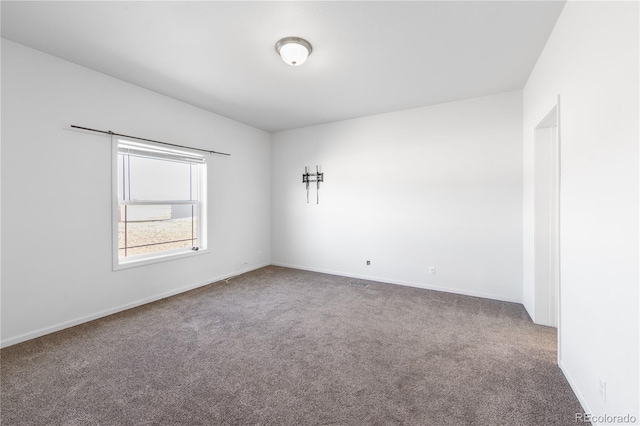 unfurnished room with carpet floors