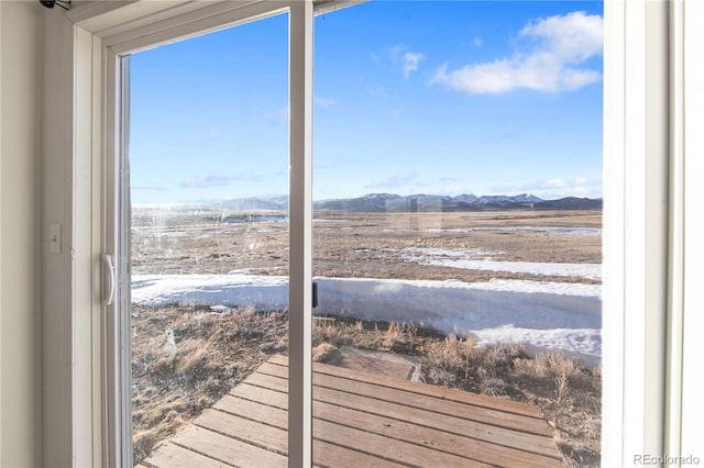 doorway to outside with a mountain view