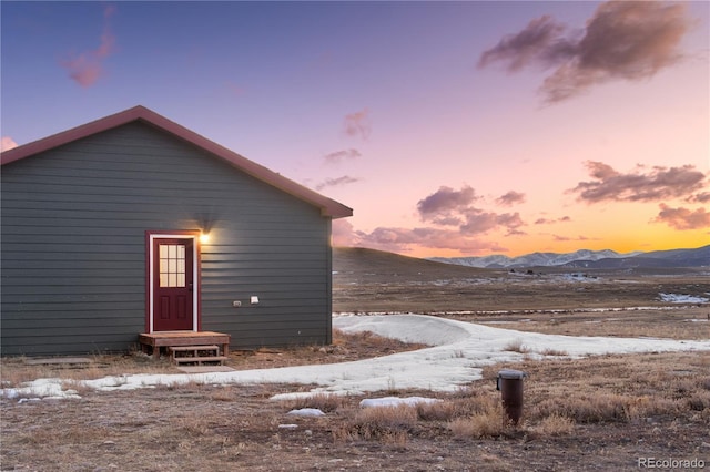 snow covered property featuring a mountain view