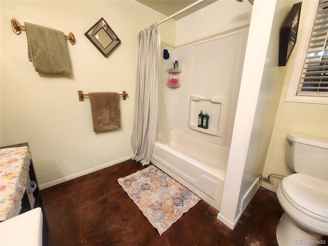 bathroom featuring shower / bath combination with curtain and toilet