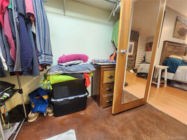 spacious closet featuring dark wood-type flooring