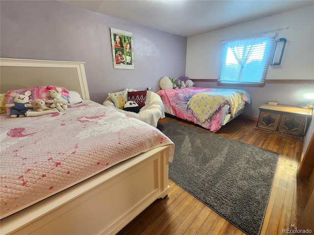 bedroom featuring dark wood-type flooring