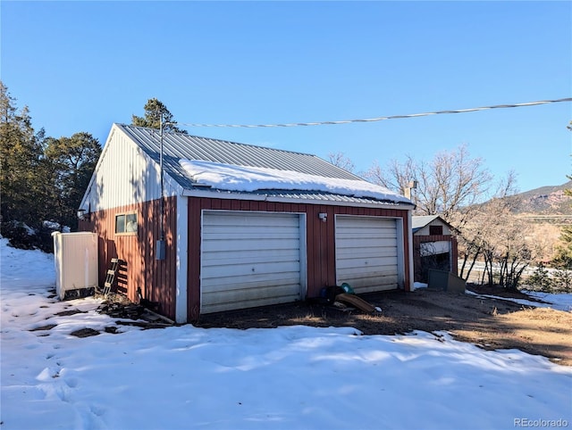 view of snow covered garage