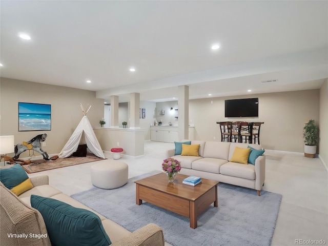 living area with recessed lighting, baseboards, and light carpet