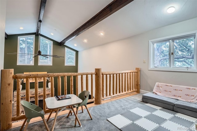 sitting room featuring ceiling fan and lofted ceiling with beams