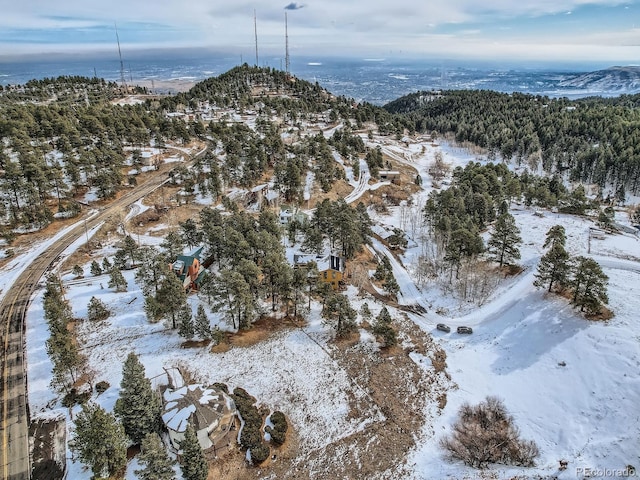 snowy aerial view featuring a mountain view