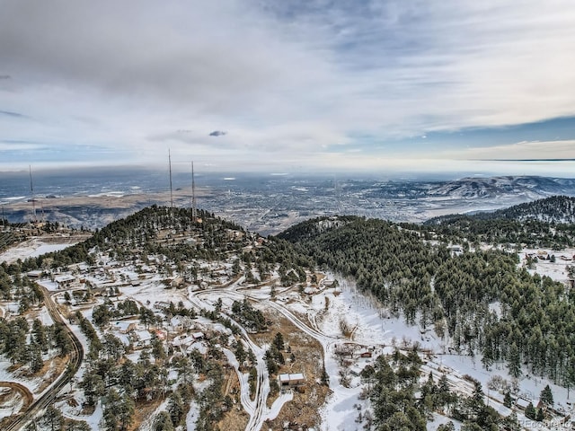 snowy aerial view with a mountain view