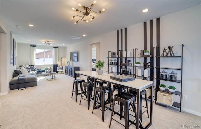 8576 Hotchkiss St, Littleton, CO 80125 - dining room featuring recessed lighting, light colored carpet, and baseboards