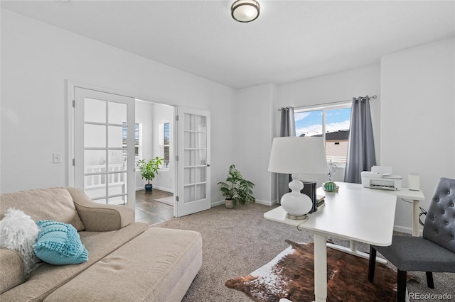 carpeted office featuring baseboards and french doors