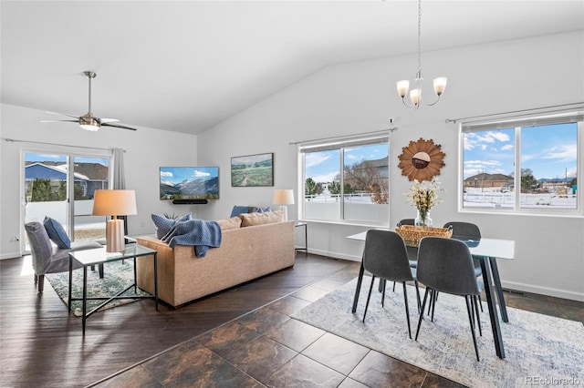 living room with lofted ceiling and ceiling fan with notable chandelier