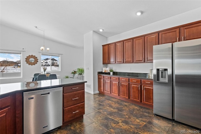 kitchen with pendant lighting, vaulted ceiling, stainless steel appliances, and an inviting chandelier