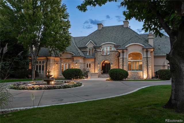 french country home with a front yard