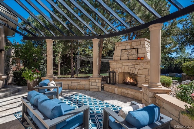 view of patio / terrace featuring an outdoor living space with a fireplace and a pergola