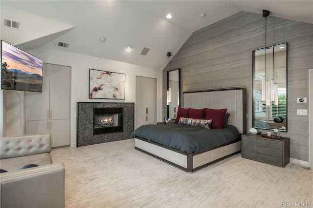 bedroom featuring high vaulted ceiling