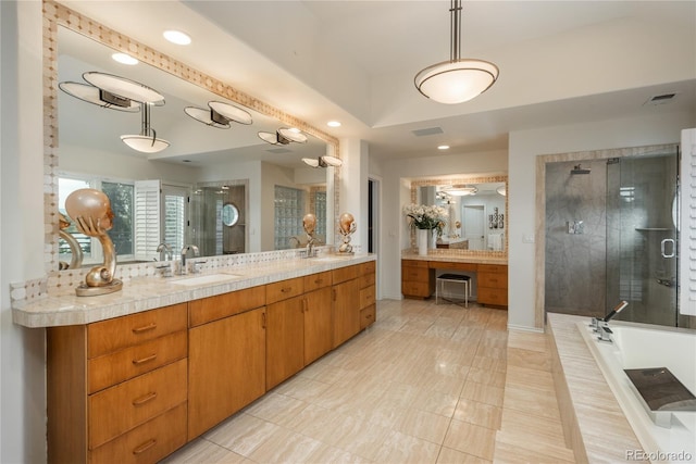 bathroom with shower with separate bathtub, vanity, and tile patterned floors