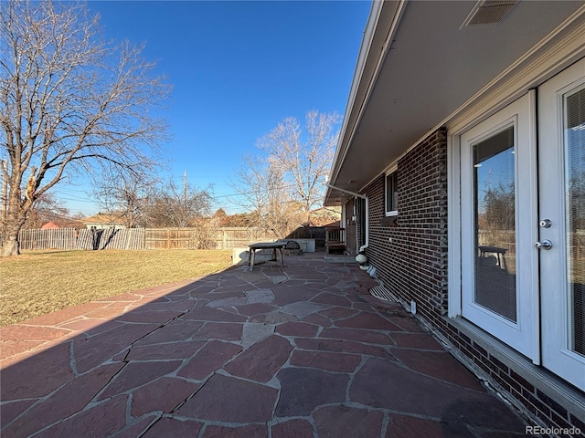 view of patio / terrace featuring visible vents and fence