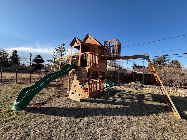 view of jungle gym featuring fence